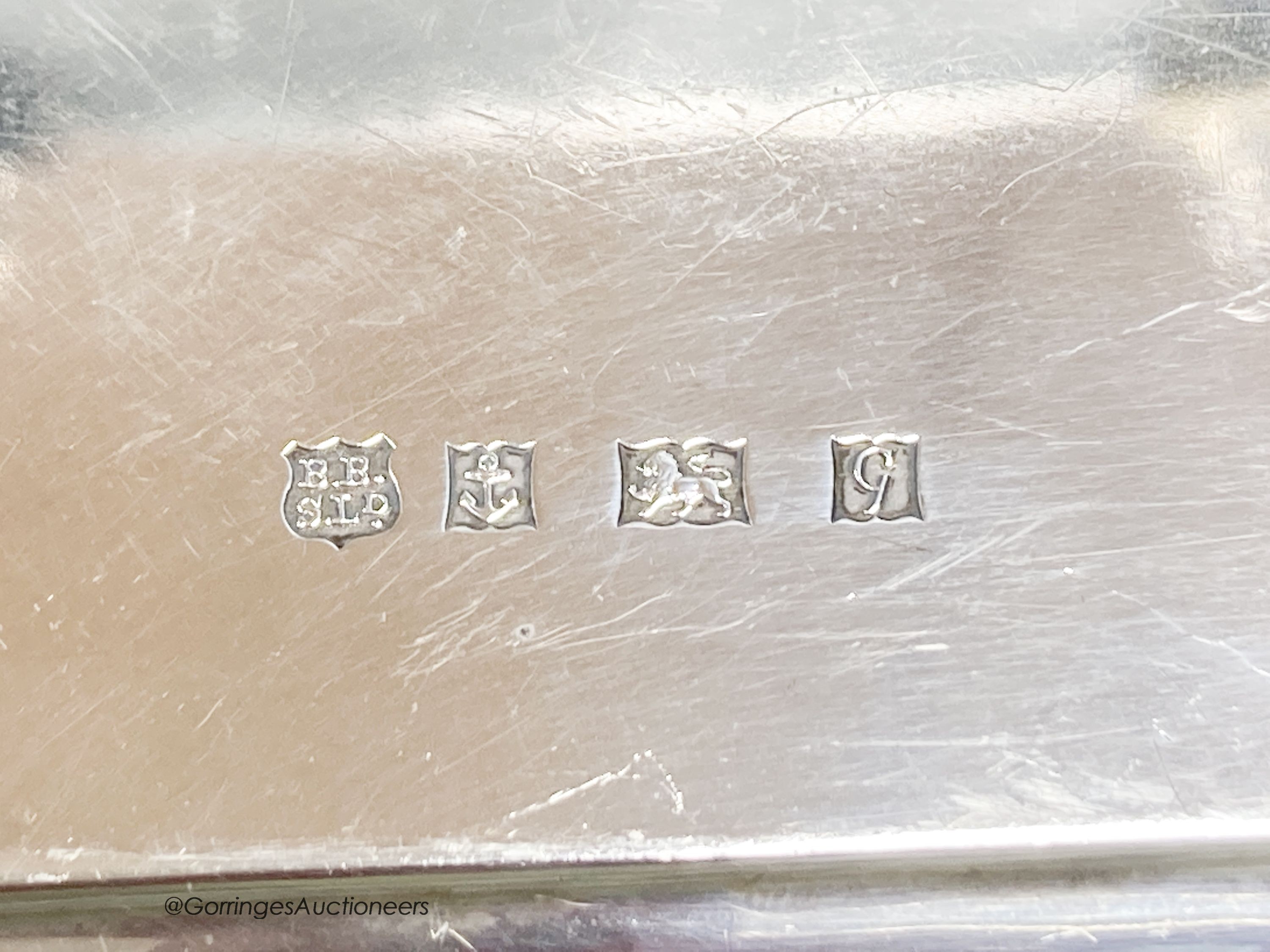 A square silver waiter with piecrust border, inscribed, Birmingham 1956, 25.9cm, with engraved inscription, 25oz.